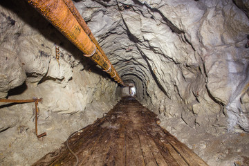 Underground old abandoned iron mine tunnel