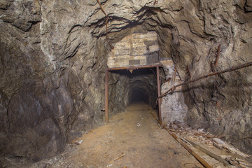 Underground abandoned iron ore mine tunnel with door