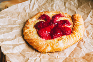 Sweet homemade creamy tart with glazed strawberry. Selective focus. Shallow depth of field.