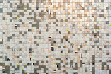 Real wall made of small clear bricks Textured background