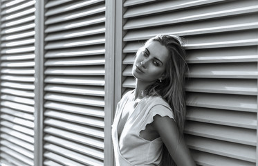 Fototapeta premium Adorable trendy dressed girl posing at the street