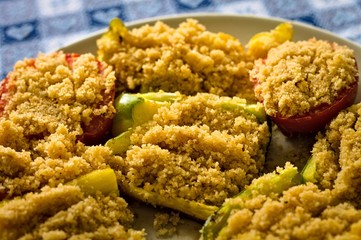 Peppers and tomatoes cooked 'au gratin' in a white dish (Pesaro, Italy, Europe)