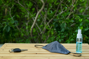 Out of the house, carry alcohol to clean hands and masks for protection against COVID-19.