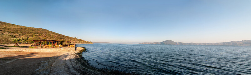 panorama of a summer cafe on the shores of the Aegean