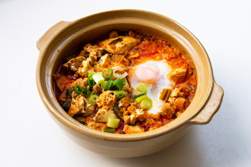 Korean spicy silken tofu stew which is called Sundubu Jjigae