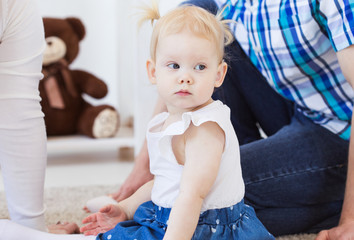Fototapeta premium Baby girl wearing a hearing aid. Disabled child, disability and deafness concept.