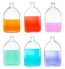 set of colour mixtures in glass flasks isolated