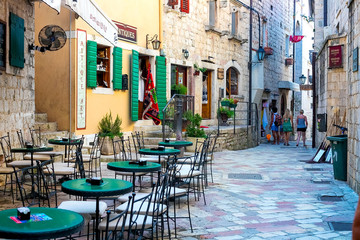 Street cafe on a narrow street in the old town of Kotor, Montenegro © Natallia