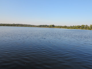     lake horizon with sunset near tree  