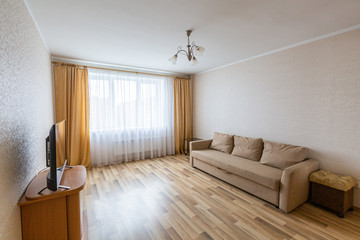 Interior of apartment with furniture after the remodeling, renovation, extension, restoration, reconstruction and construction.
