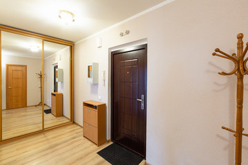 Interior of hallway apartment with furniture after the remodeling, renovation, extension, restoration, reconstruction and construction.