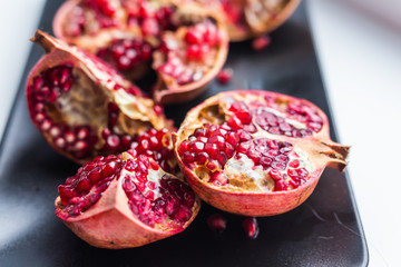 Fresh ripe pomegranate on table close up. Fruit , vitamins and food concept.