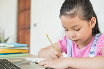 asian girl student online learning study online with video call teacher. social distance during quarantine, self-isolation, online education concept, homeschool, stay at home entertainment.
