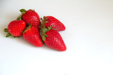 Flat lay composition with with tasty ripe strawberries on light background