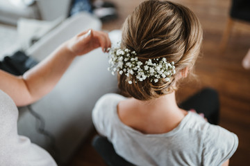 photo of flowers in a brides hair getting ready