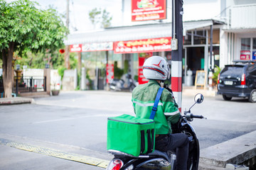 Motorbike driver delivering food