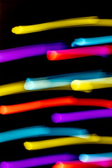 Abstract Neon Lights on Black Background Blurred and Moving 80s Vibe Disco