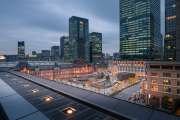 Fototapeta na wymiar Tokyo Station and skyscrapers in the Marunouchi business district area in Tokyo, Japan during twilight hours