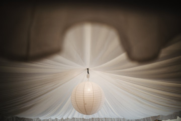 photo of a paper light in the ceiling