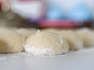 dough and flour on white table, bakery.  baking bread, selective focus and bokeh