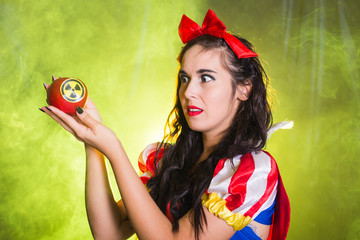 Woman dressed as fairytale character holds Radioactive atomic nuclear ionizing radiation danger...
