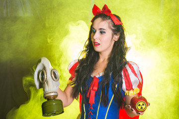 Woman holding hazardous radioactive apple. Nuclear and radiation measurement concept.