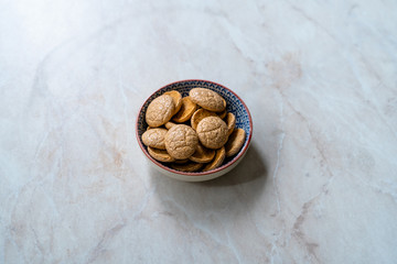 Chewy Soft Italian Amaretti Cookie Biscuits in Ceramic Bowl.