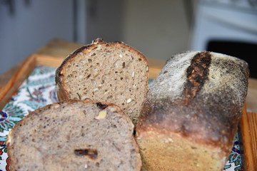 A fresh crusty loaf of homemade bread. Homemade rustic sour. Brown bread. Different types of loaves. Sliced Bread