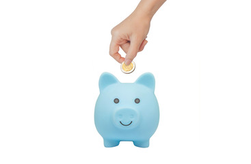 Money Savings Concept : Female hand holding banknote and putting to blue piggy bank.