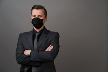 Young businessman with surgical medical mask