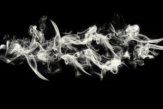 Abstract image of White smoke or fog in black background.
