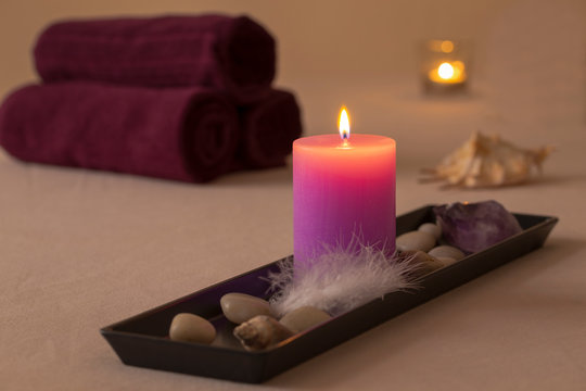 wellness spa decoration with candles and towels