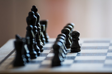 Chess pieces on the chess board with selective focus and crop fragment. Business and motivation...