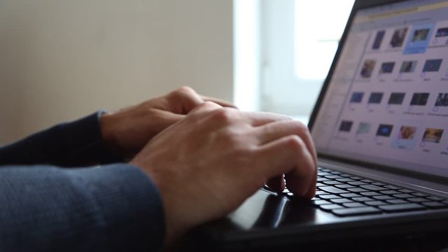 Men's hands press buttons on laptop clitoris on monitor are enping pictures
