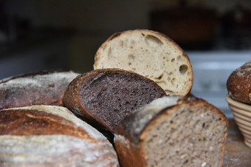 A fresh crusty loaf of homemade bread. Homemade rustic sour. Brown bread. Different types of loaves. Sliced Bread