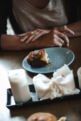 woman eating a cinnamon roll
