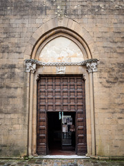 Fototapeta na wymiar Imposing portal from the church of San Francesco in Pienza, Italy, dating back to 1200.
