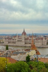Fototapeta premium Landscape view of Hungarian Parliament Building (Országház) on the Danube during rainy day