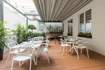 Beautiful restaurant summer terrace interior with moving roof