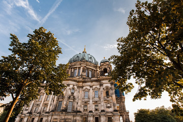 Beautiful view of Berliner Dom. Cityscape with Berlin cathedral and green trees
