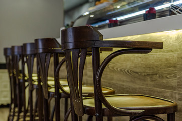 Wooden stools for customers in a bar