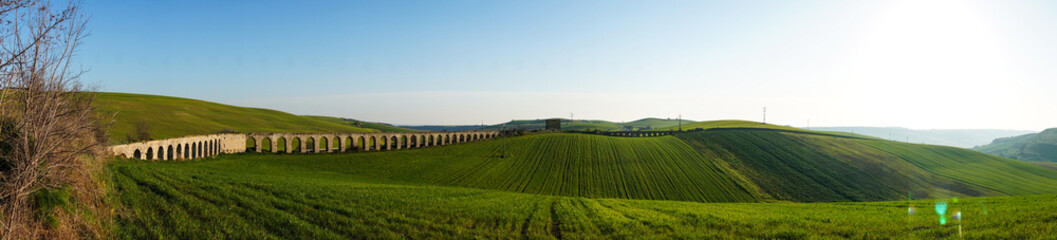 Fototapeta na wymiar Panoramic view of ancient roman aqueduct