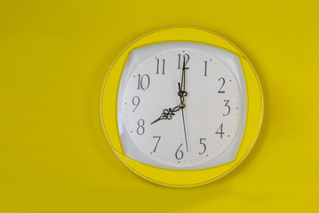 Close up  Yellows clock face beginning of time 8.00 on Yellows background,Time concept.