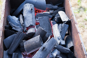 Burning charcoal in a barbecue. Get ready for barbecue.