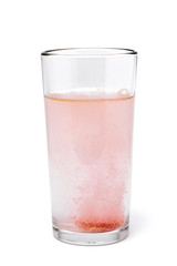 soluble effervescent multivitamin in a glass glass with water on a white background