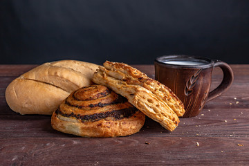croissant with milk on a wooden table