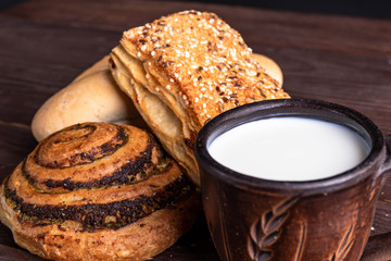croissant with milk on a wooden table