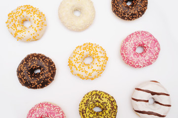 Delicious donuts on light background.