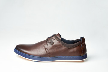 Men fashion brown shoe leather over white background. Pair casual stylish footwear.