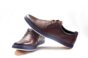 Men fashion brown shoe leather over white background. Pair casual stylish footwear.